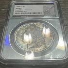1884-O Morgan Silver Dollar NGC MS64 S$1, VaultBox Halo Core, Toned,