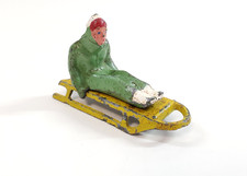 VTG Barclay Christmas Winter Village Lead Toy Green Figure Rider Sledding Sled