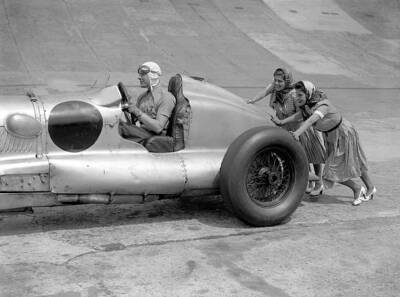 Oliver Bertram sits at the wheel of his Barnato Hassan as two frie- Old Photo