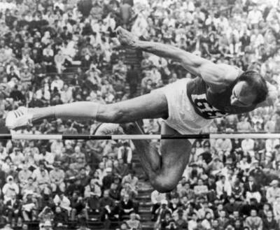 Soviet athlete Robert Shavlakadze clears bar during High Jump e- 1964 Old Photo