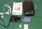 Canon PowerShot ELPH SD1400 IS Digital Camera W/ Battery SD Card & Charger READ