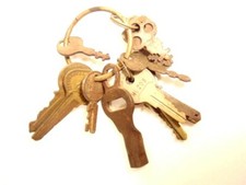 vintage ring of about 15 assorted keys - one vintage 1950s roller skate key