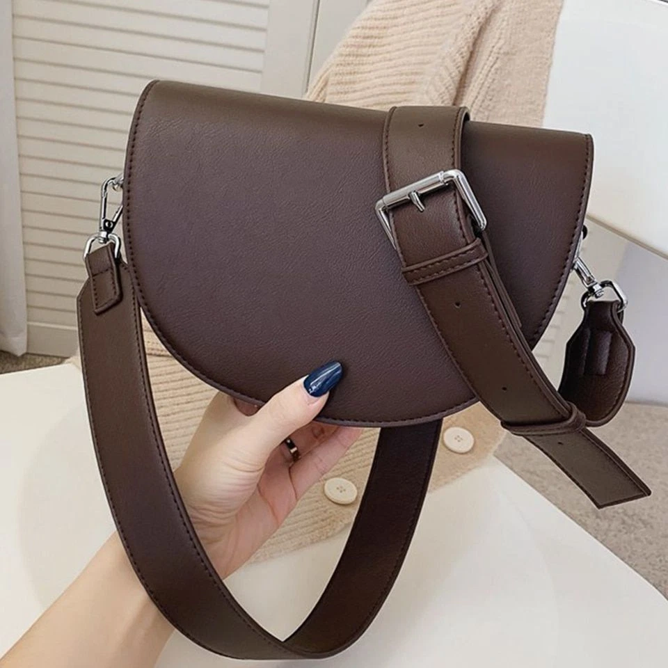 Saddle bag top style handbags
