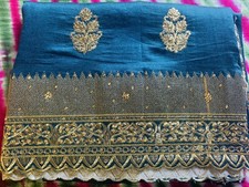 Indian party wear silk saree in peacock blue.