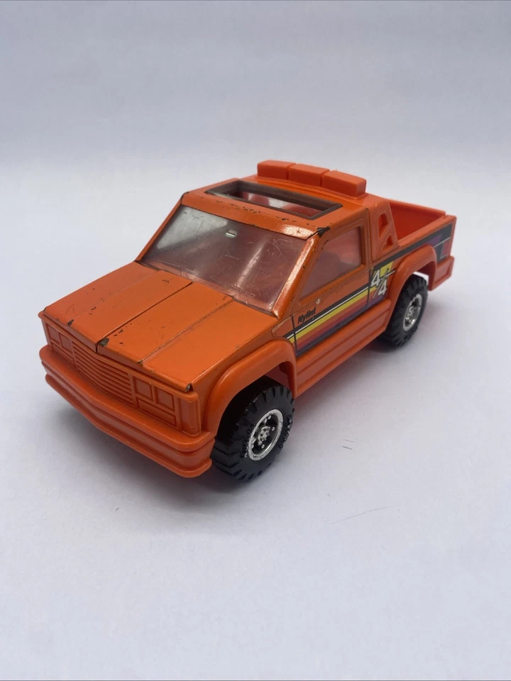 Camioneta pickup NyLint 1989 vintage 4 X 4 naranja acero prensado y plástico techo corredizo Foto 3 de 4