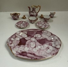 Vintage 10-piece porcelain miniature tea set. In great condition. Tray is 4 x3