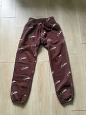 corteiz joggers brown and white logo size small