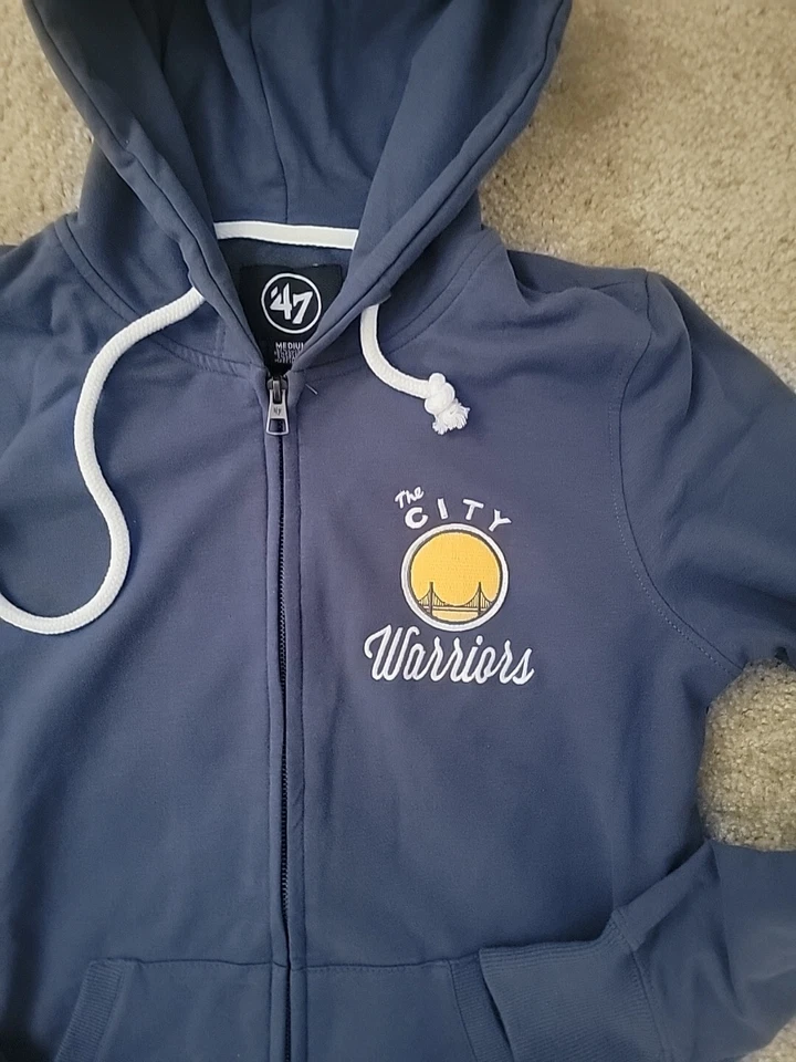 Sudadera con capucha Golden State Warriors azul marca The City 47 cremallera talla mediana para mujer Foto 2 de 3