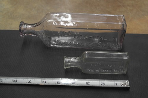 2 Vintage Embossed Medicine Bottle, Moe Hospital (1917-1939) in Sioux Falls, SD.