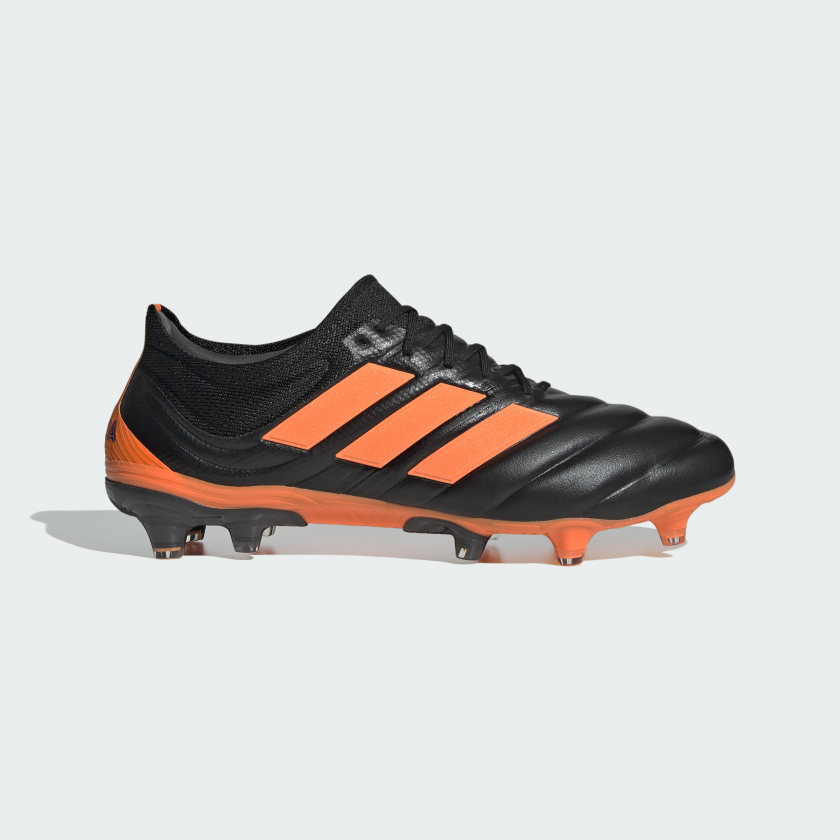 orange and black adidas soccer cleats