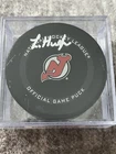 NHL New Jersey Devils Luke Hughes Autographed Official Game Puck Fanatics