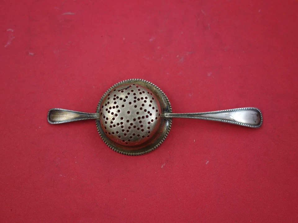 Colador de té Bead by Birks de plata de ley 6 3/4" Foto 2 de 2