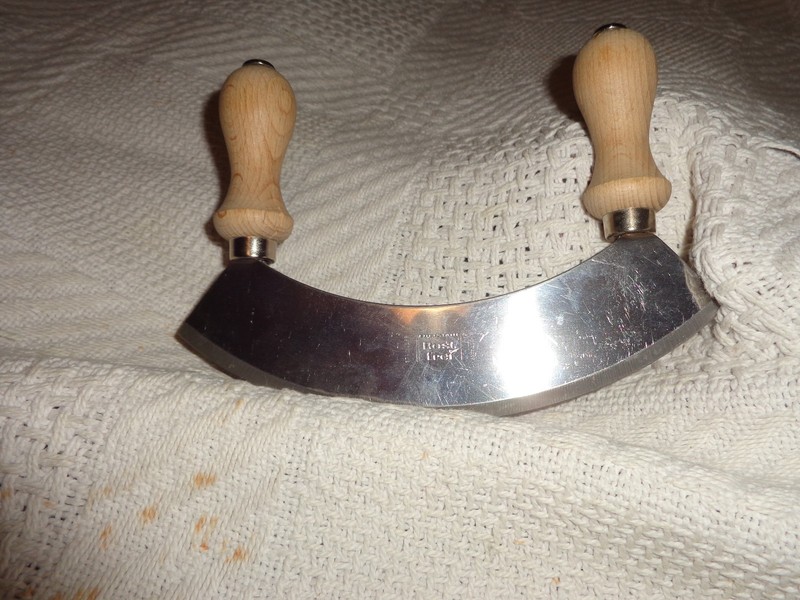rostfrei food chopper. stainless with wood handles.