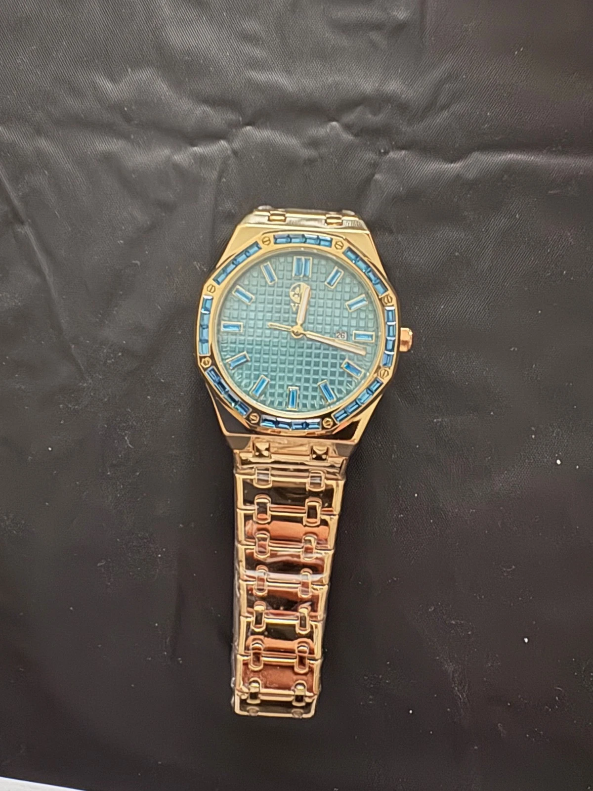 Gold on steel plate blue gem watch mens