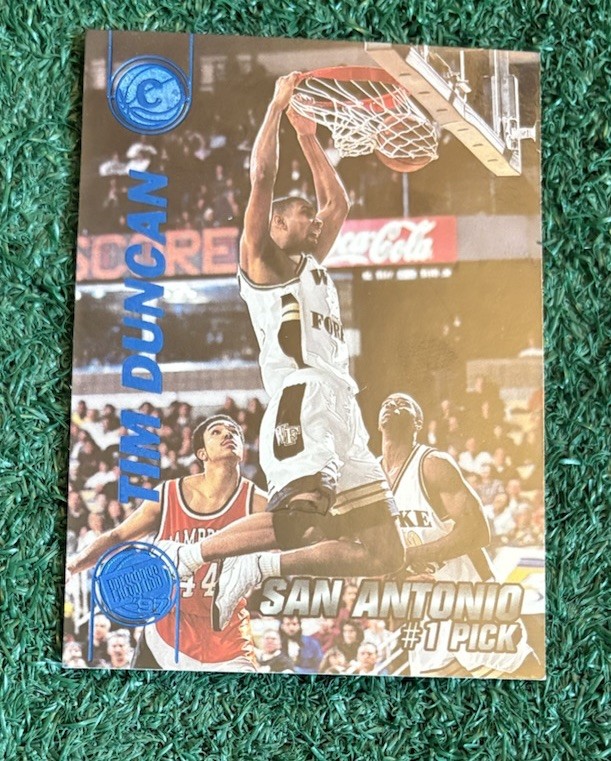 TIM DUNCAN - NBA HOF - 1997 PRESS PASS BLUE TORQUERS PARALLEL ROOKIE CARD # 1