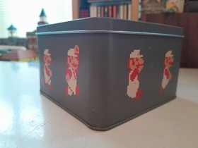 Super Mario Bros Jigsaw in a collectable Nes Cartridge style metal tin. Nintendo