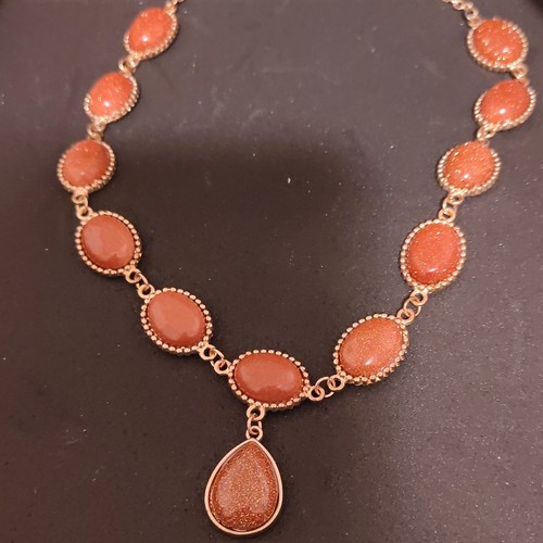 Goldstone Teardrop Pendant Necklace with Oval Accents in Gold and Orange