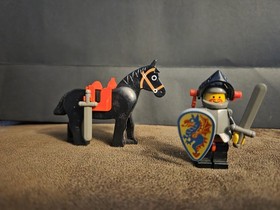 LEGO&reg; 6009 Black Knight is It features a knight minifigure, a horse, two swords.