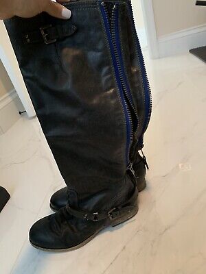 black boots with blue zipper
