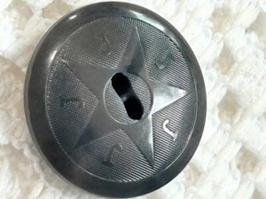 Veg Ivory Pictorial or Pattern Star w/ Verbal "J".  Gray Sew-thru. 7/8"