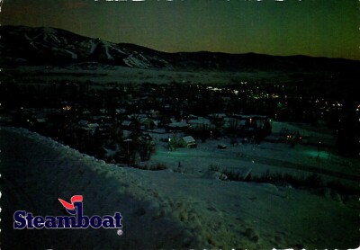 Twinkling Lights Of Steamboat Springs At Twilight Colorado Postcard