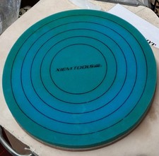 Xiem Tools centreing aid sponge with rings and adhered to a wooden Batt.