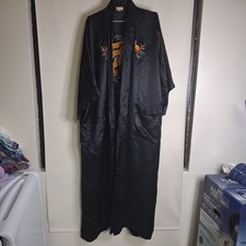 Vintage black silk kimono featuring intricate embroidery of a golden dragon.