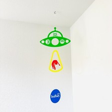 Fun UFO Encounter: Adorable Multicolor Aliens Abducting a Human in a Flying Sauc
