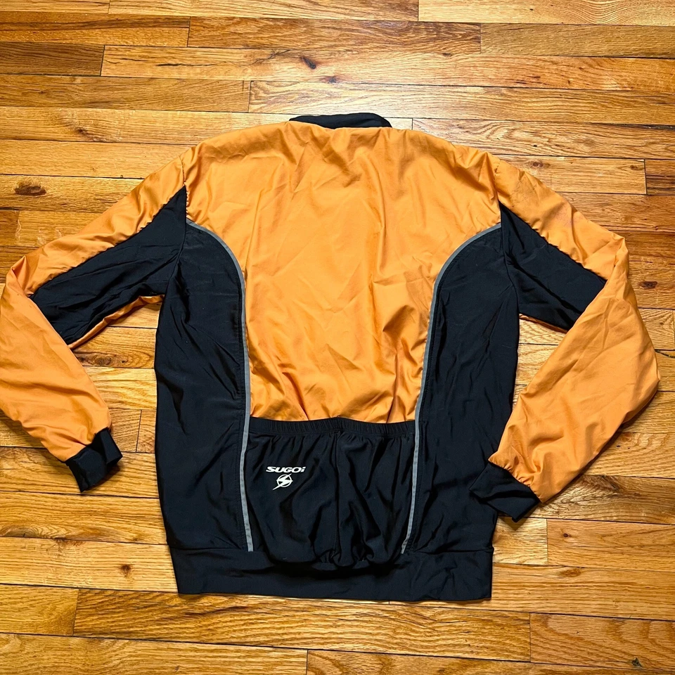 Chaqueta cortavientos Sugoi para mujer cremallera completa talla S naranja/negro manchada Foto 4 de 4