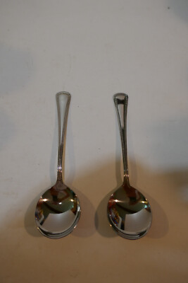 Two  NOS  Oneida Ltd stainless flatware Needlepoint  Bouillion  Spoons