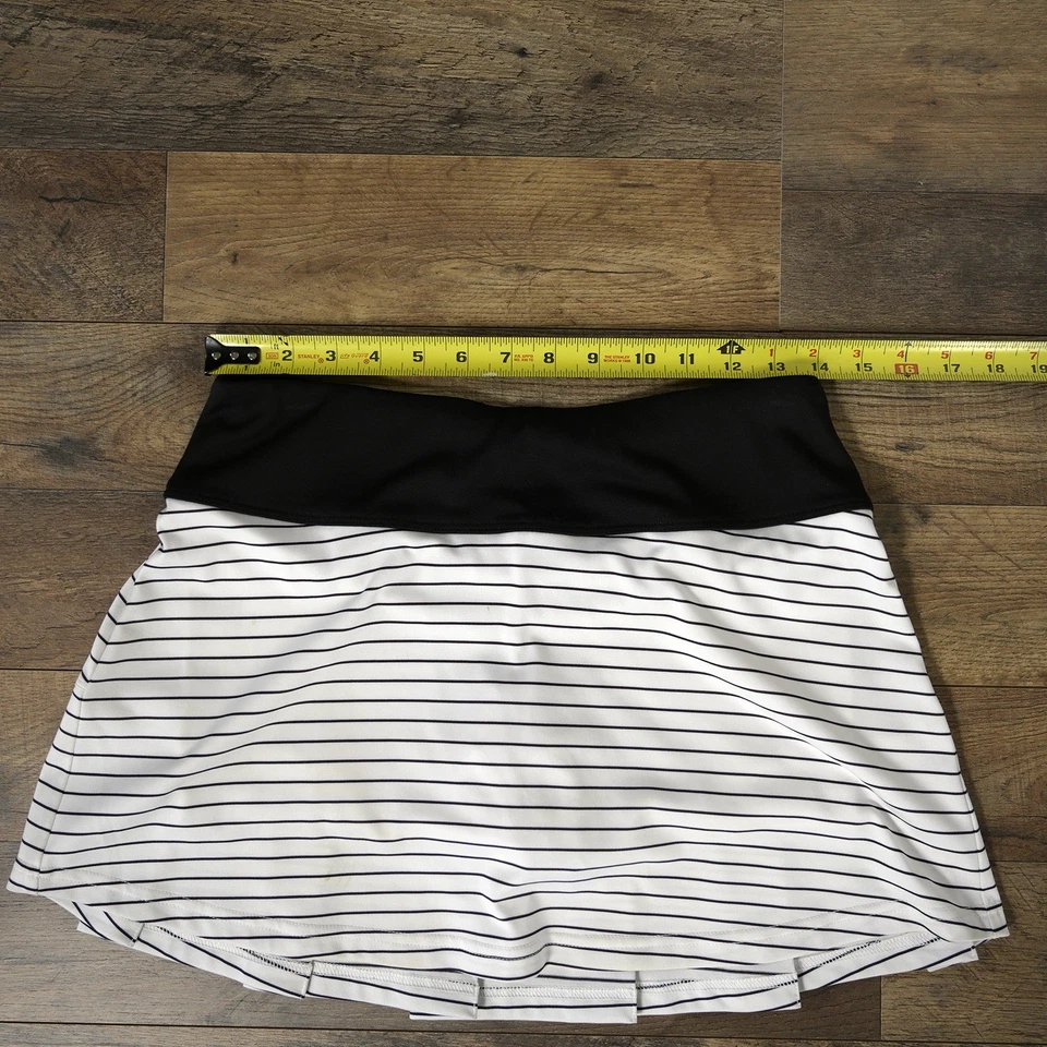 Falda atlética plisada a rayas blancas y negras Bolle Tech para mujer S. Foto 3 de 4
