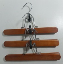 3x clamp type clothes hangars light colored wood