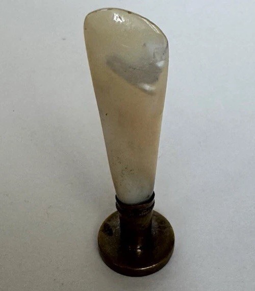 A genuine antique wax seal stamp with mother-of-pearl handle and personalized 'LF' monogram — practically a piece of jewelry for your desk.