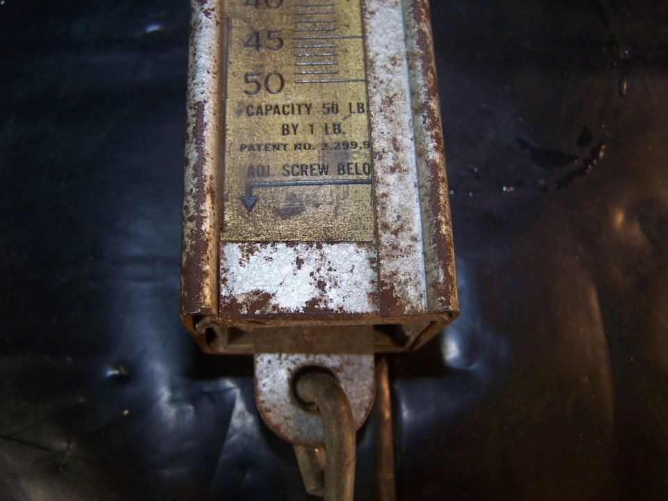 Hacksaw and a 200 lb. hanging scale - AAA Auction and Realty