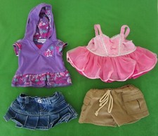 LOT 4 BUILD A BEAR CLOTHING: PINK TUTU; PURPLE HOODED TOP, JEAN SKIRT,TAN SHORTS