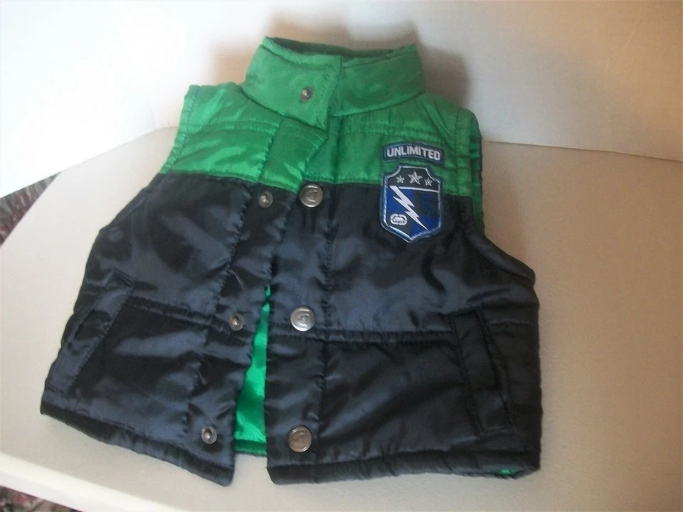 Chaleco aislante infantil verde negro broches de presión Rhino 9 meses Foto 2 de 4