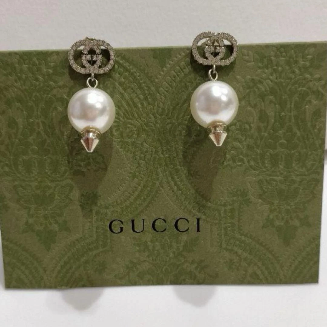 Autentici orecchini Gucci logo ad incastro in pietra accessori usati dal Giappone