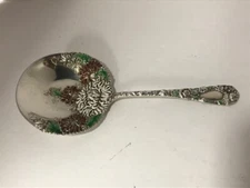 Durgin Chrysanthemum enamel sterling nut spoon. 5 1/4" long