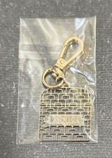 Charm logo crema pelle La Mer per borsa portachiavi filigrana mai aperto