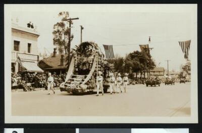 Parade with a float and marchers 1920 California Old Photo