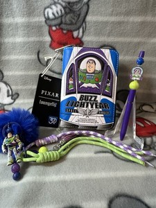 Loungefly Disney Pixar Buzz Lightyear Space Ranger wallet with keychain and pen.