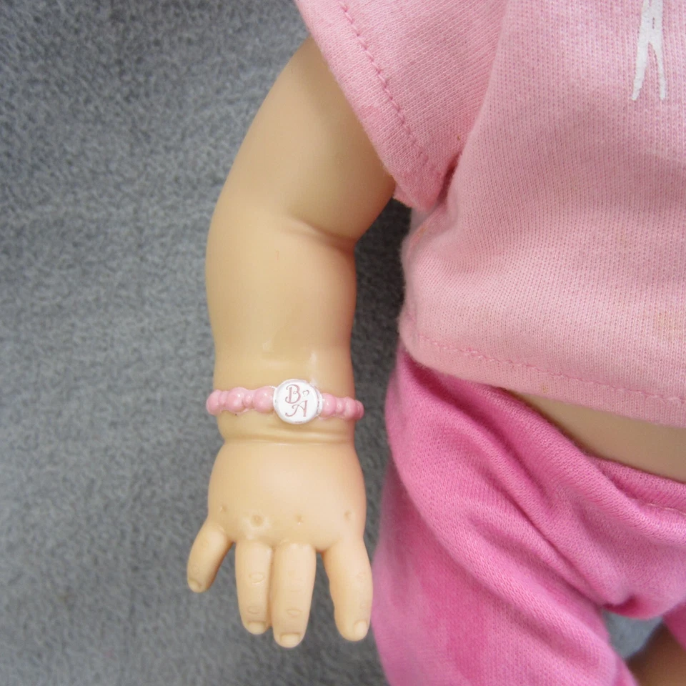 Muñeca interactiva Hasbro Baby Alive Wets N Wiggles de colección 12 pulgadas Foto 3 de 4