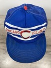 Blue snapback trucker hat with white and red stripe embroidery and a red button on the front panel.