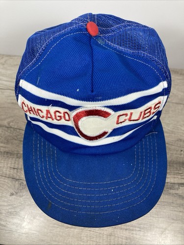 Blue snapback trucker hat with white and red stripe embroidery and a red button on the front panel.