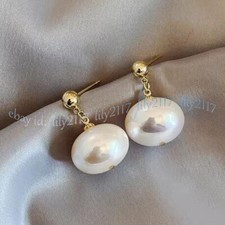 Enormes aretes colgantes de oro con cuentas ovaladas de perlas con con concha de mar del Sur con huevo blanco de 19 mm