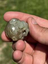 CHINESE 18TH CENTURY CELADON AND RUSSET JADE MONKEY AND FRUIT QING DYNASTY