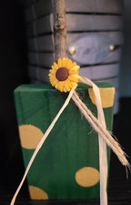 Fall, green wood block pumpkin with wood stem and plastic sunflower.