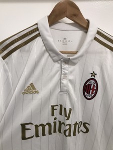 fly emirates white and gold jersey