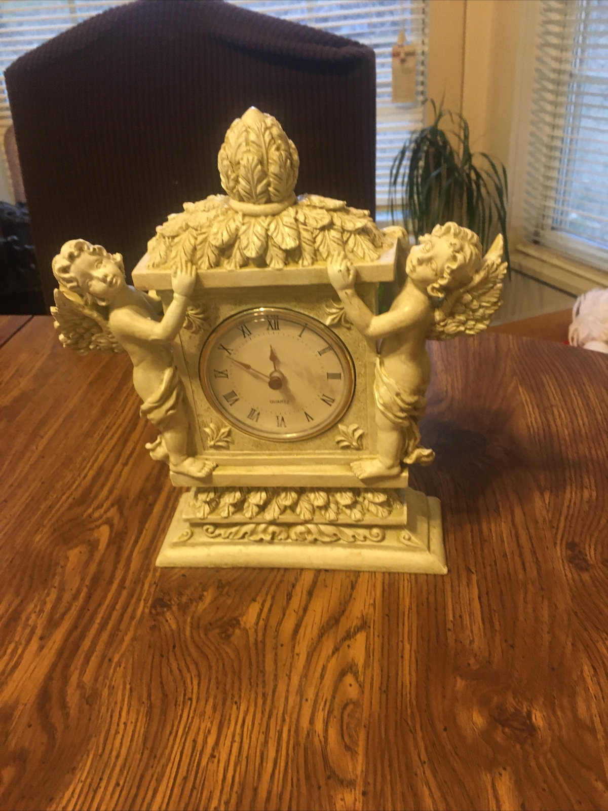 Quartz’s Clock with resin Angel on each side of Clock with leaves on