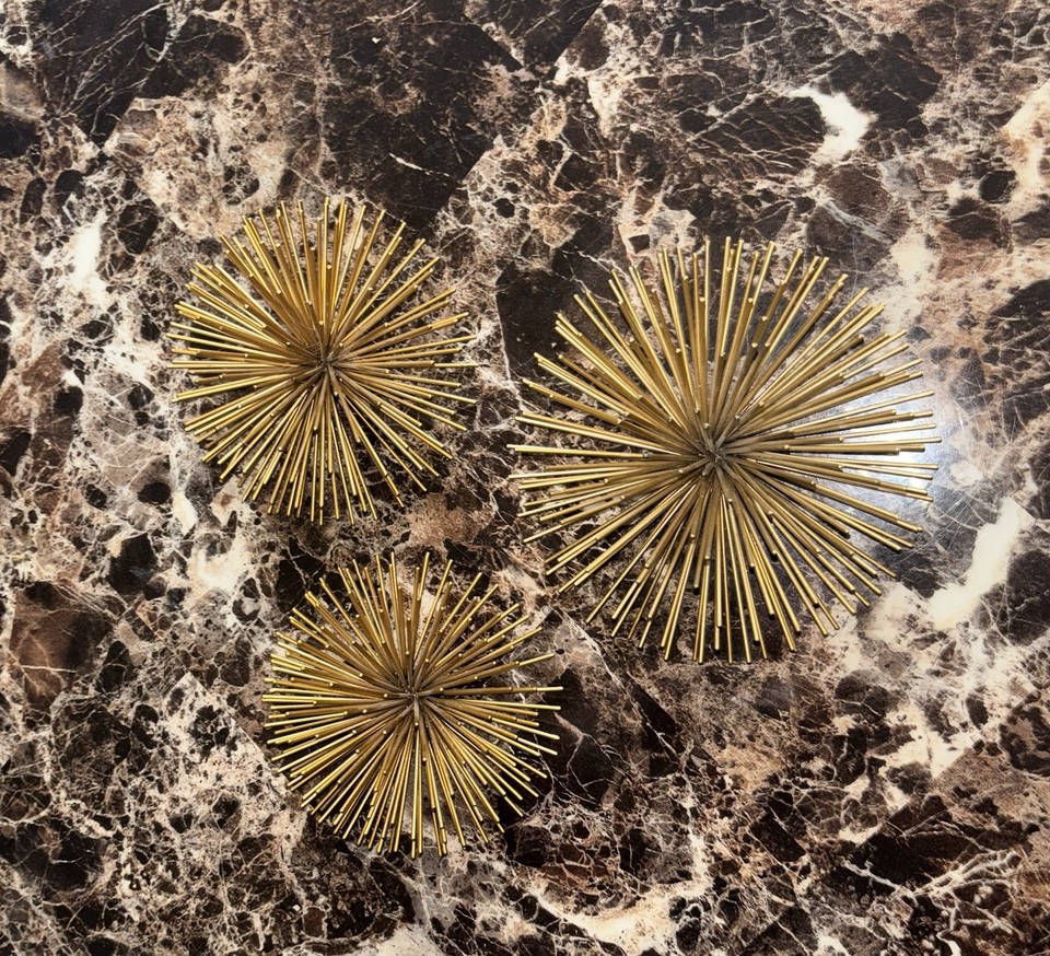A set of three genuine vintage metal sea urchin atomic wall bursts — the kind of MCM statement decor you simply cannot find new.